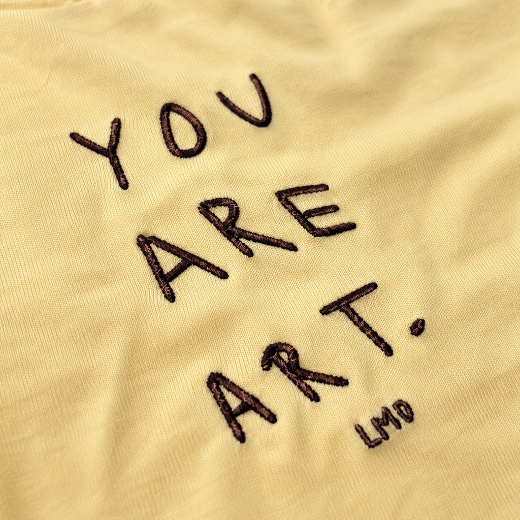 POLERA SLIM FIT MANTEQUILLA “YOU ARE ART”