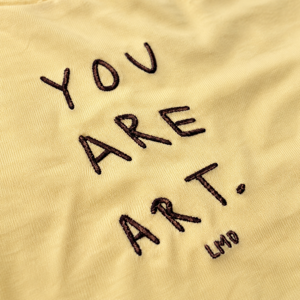 POLERA SLIM FIT MANTEQUILLA “YOU ARE ART”